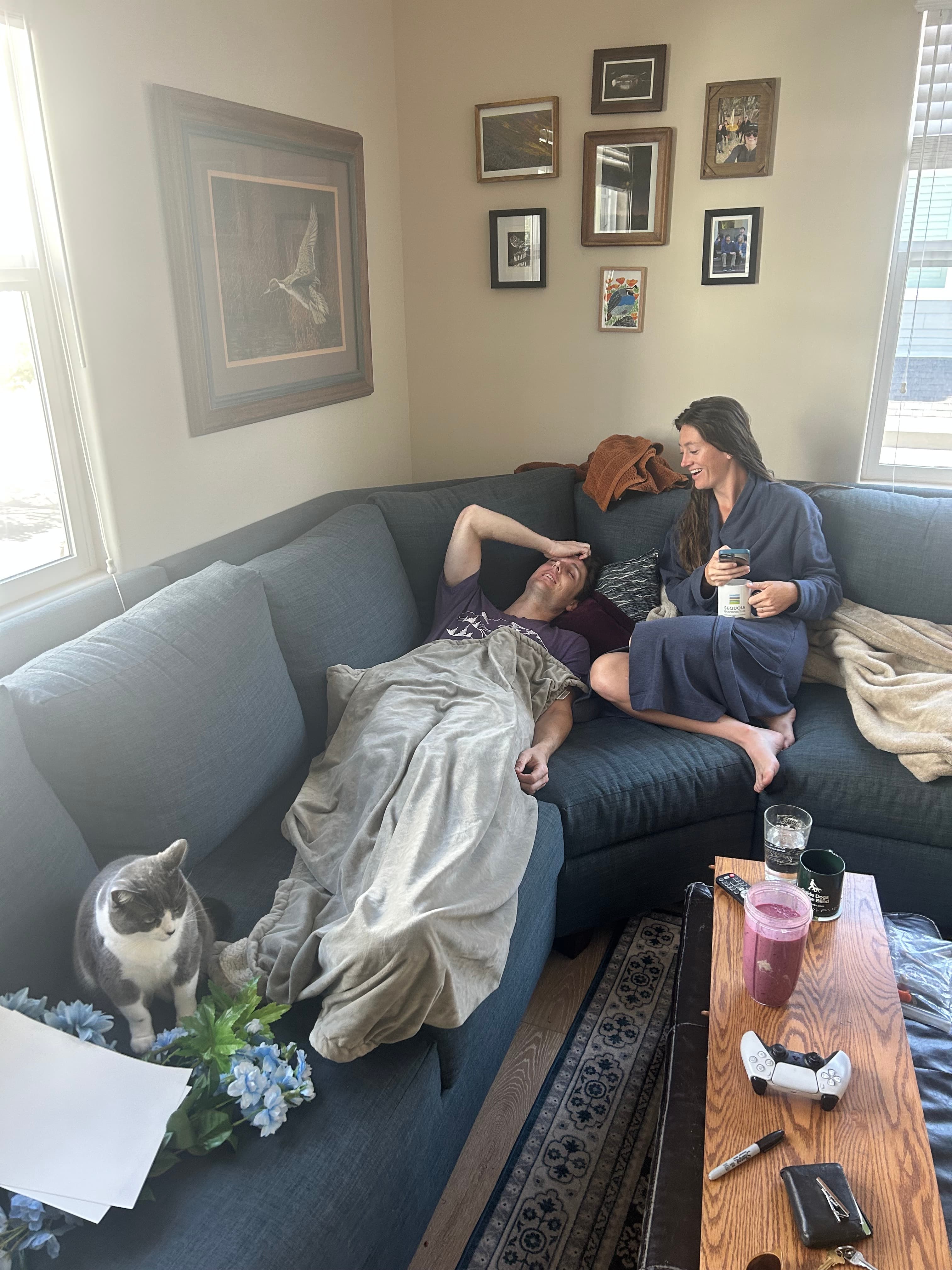 Owen, Lindsay, and their cat Penelope the morning after their wedding.