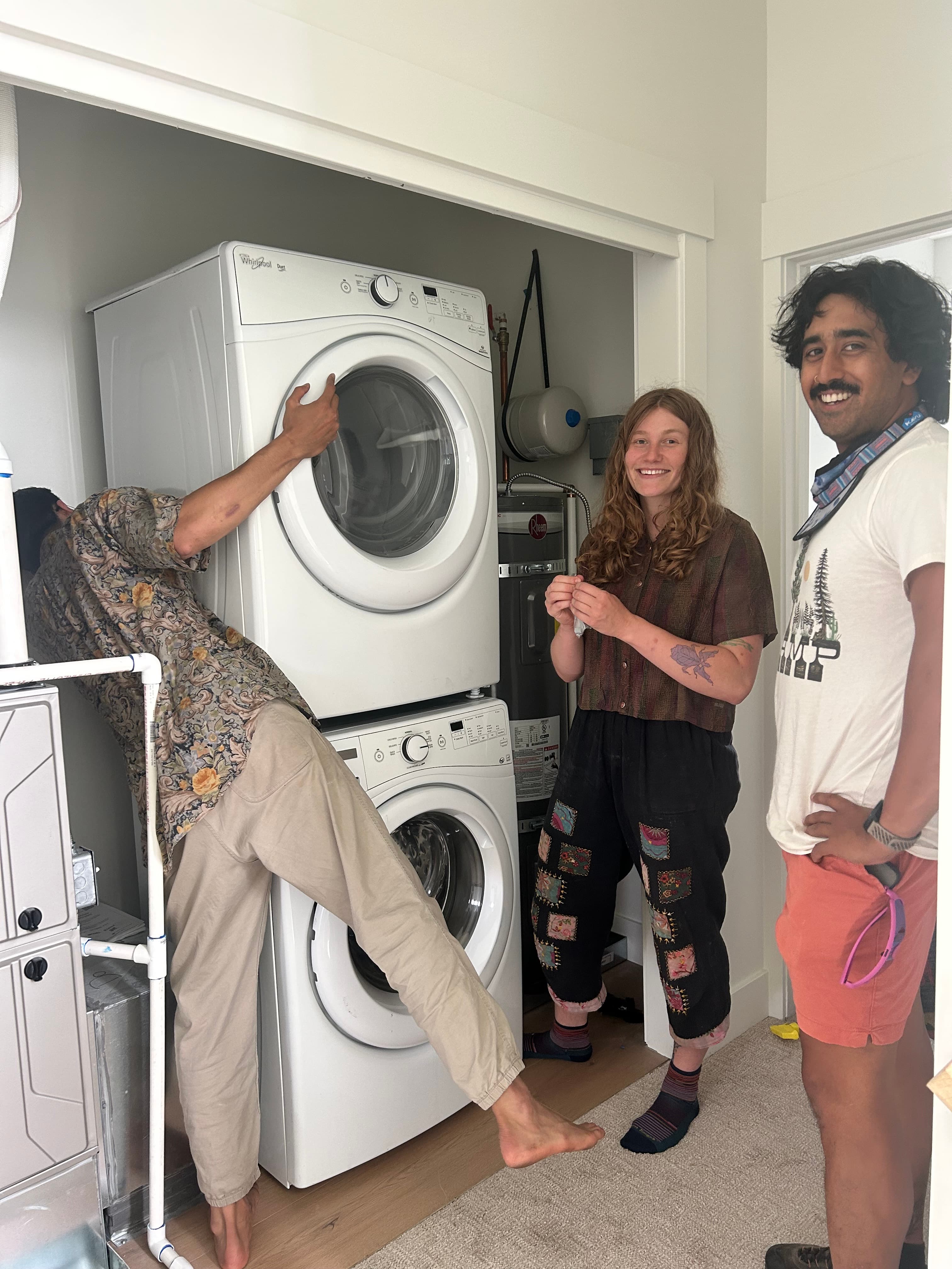 Moving a washing machine with Margot, Kiet, and Evan.
